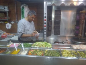 This man is the giver of falafels. Note the amazing fixins bar.